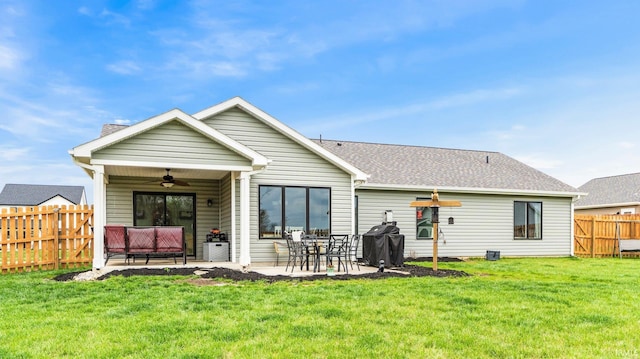 1905 Waynedale Dr, Garrett, IN 46738 - rear view of house featuring a patio, a fenced backyard, a ceiling fan, and a yard