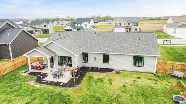 1905 Waynedale Dr, Garrett, IN 46738 - back of property featuring a residential view, a yard, and a patio area