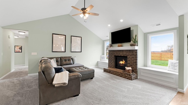 1905 Waynedale Dr, Garrett, IN 46738 - living area featuring a healthy amount of sunlight, visible vents, ceiling fan, and a fireplace