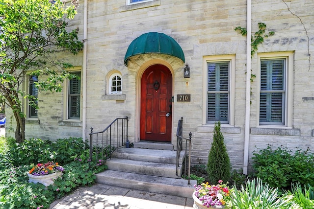 view of exterior entry with stone siding