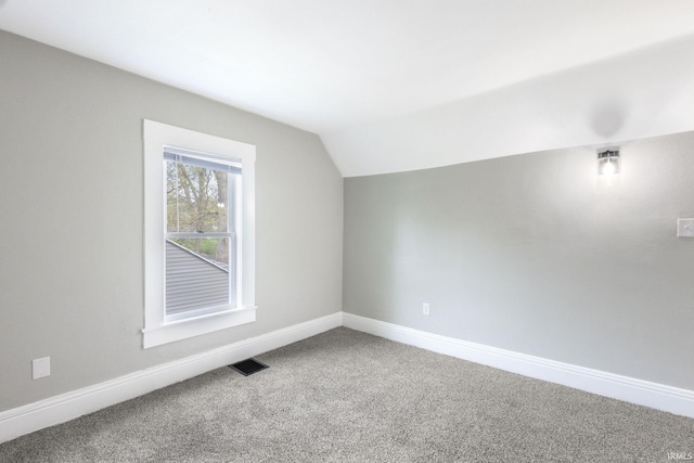 bonus room with visible vents, carpet flooring, vaulted ceiling, and baseboards