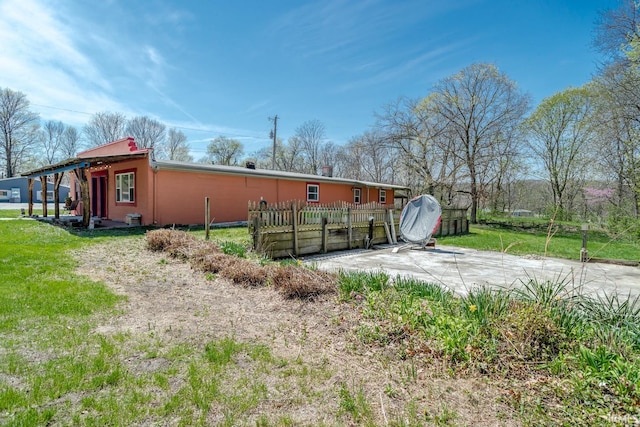 exterior space with a yard and fence