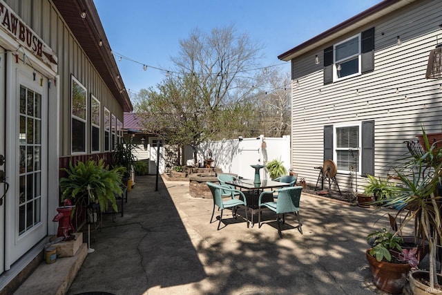 view of patio / terrace featuring fence and outdoor dining area