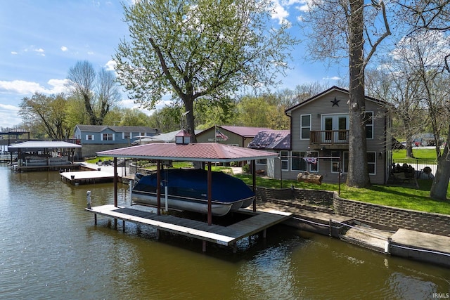 view of dock with a lawn, a water view, a balcony, and boat lift