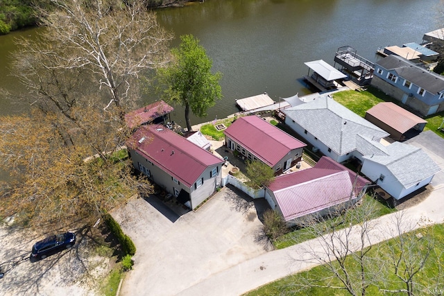 drone / aerial view featuring a residential view and a water view