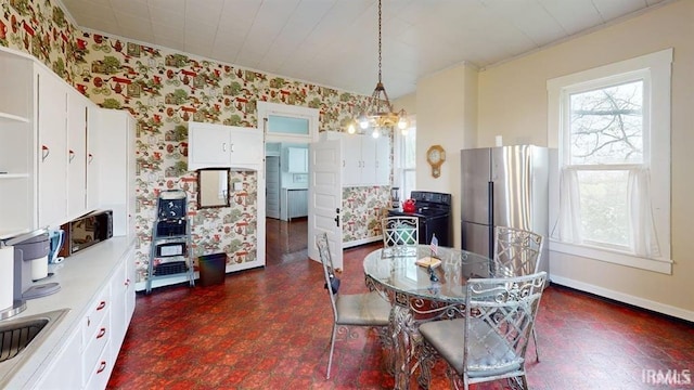 410 Riverside Dr, Jasper, IN 47546 - dining room with wallpapered walls, baseboards, and crown molding