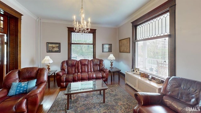 410 Riverside Dr, Jasper, IN 47546 - living area with wood finished floors, a chandelier, healthy amount of natural light, and crown molding