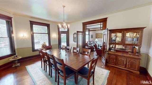 410 Riverside Dr, Jasper, IN 47546 - dining room featuring dark wood-type flooring, a chandelier, healthy amount of natural light, and ornamental molding