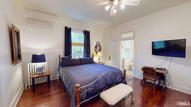 410 Riverside Dr, Jasper, IN 47546 - bedroom featuring radiator heating unit, a wall unit AC, wood finished floors, and connected bathroom