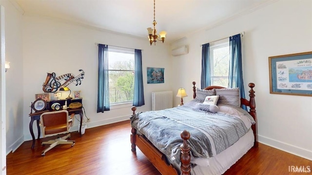 410 Riverside Dr, Jasper, IN 47546 - bedroom with radiator, a chandelier, wood finished floors, and baseboards