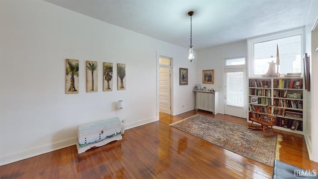 410 Riverside Dr, Jasper, IN 47546 - foyer featuring radiator, wood finished floors, and baseboards