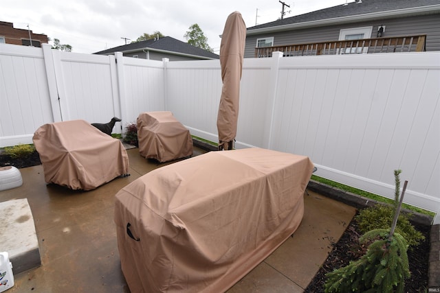 view of patio featuring a fenced backyard and grilling area