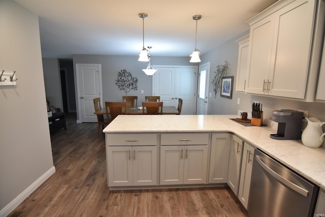 kitchen with pendant lighting, light stone countertops, dishwasher, wood finished floors, and a peninsula