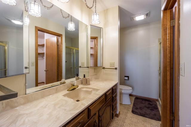 bathroom featuring toilet, a stall shower, visible vents, and vanity
