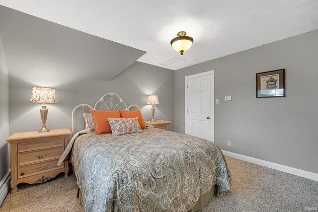 302 N Main St, Culver, IN 46511 - bedroom featuring carpet flooring, baseboards, and a baseboard radiator