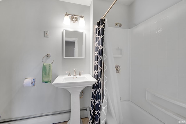 302 N Main St, Culver, IN 46511 - full bath featuring a baseboard heating unit and shower / tub combo