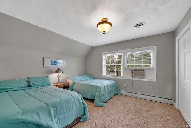 302 N Main St, Culver, IN 46511 - carpeted bedroom with a baseboard radiator, cooling unit, a closet, vaulted ceiling, and baseboards