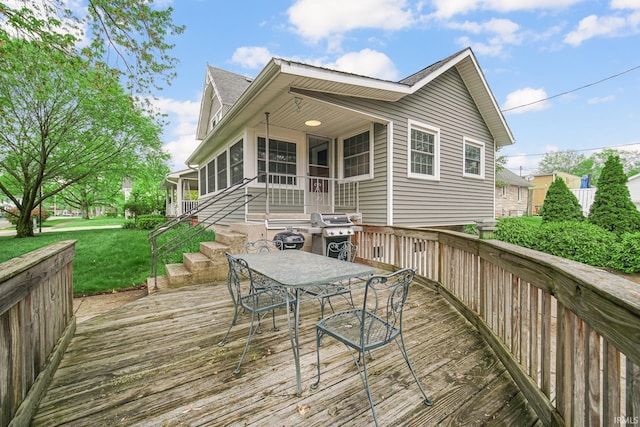 302 N Main St, Culver, IN 46511 - wooden deck featuring a lawn and outdoor dining space