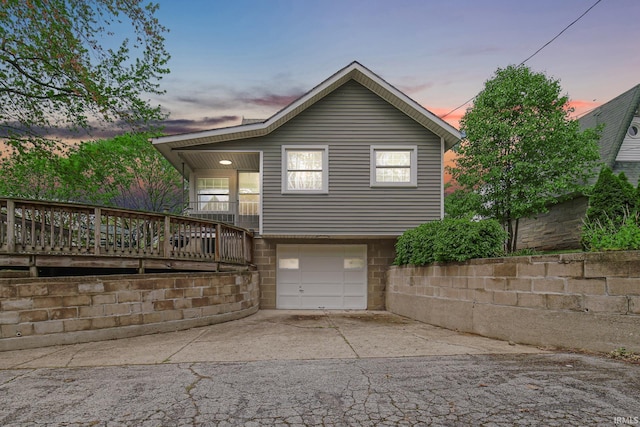 302 N Main St, Culver, IN 46511 - view of front of home with driveway and a garage
