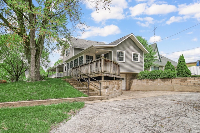 302 N Main St, Culver, IN 46511 - back of house with a deck, stairs, and driveway