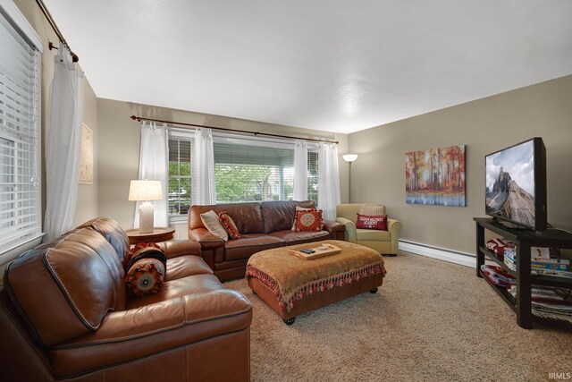 302 N Main St, Culver, IN 46511 - living room featuring a baseboard radiator, carpet, and baseboards