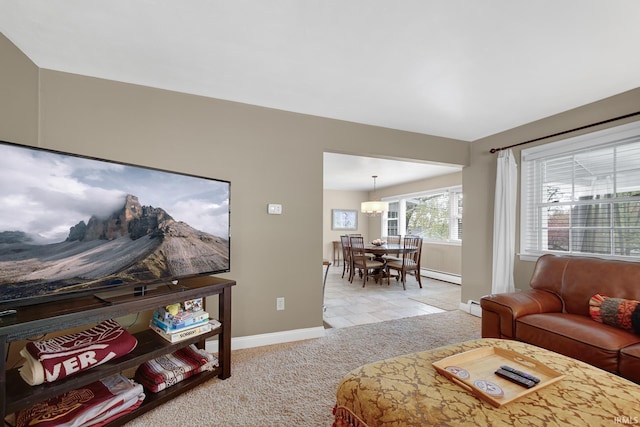 302 N Main St, Culver, IN 46511 - living room featuring baseboards, light colored carpet, a chandelier, and baseboard heating