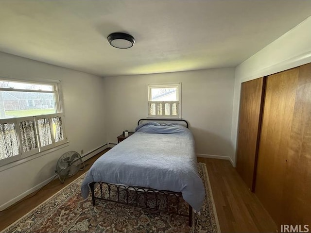 540 Fairfield Dr, Wabash, IN 46992 - bedroom with wood finished floors, multiple windows, and a closet