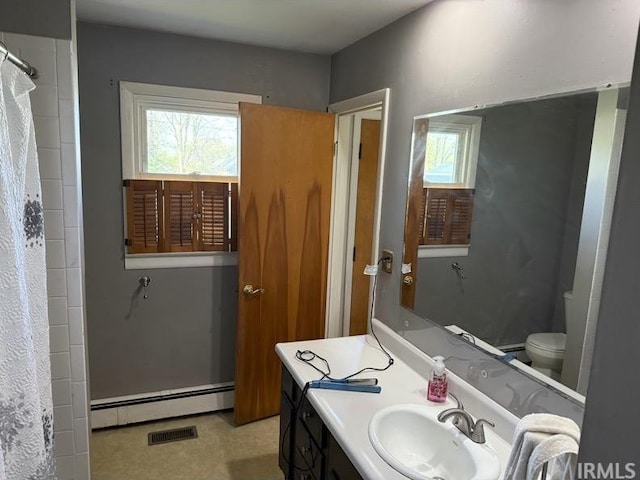 540 Fairfield Dr, Wabash, IN 46992 - bathroom with a shower with curtain, visible vents, a baseboard heating unit, toilet, and vanity