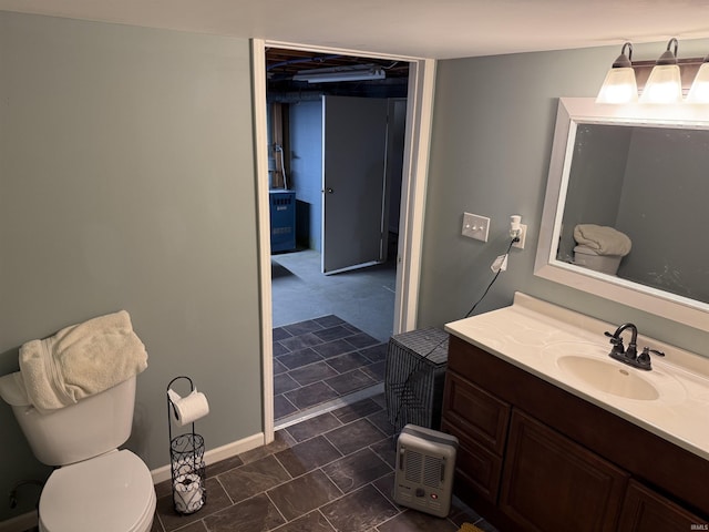540 Fairfield Dr, Wabash, IN 46992 - bathroom with toilet, vanity, and baseboards