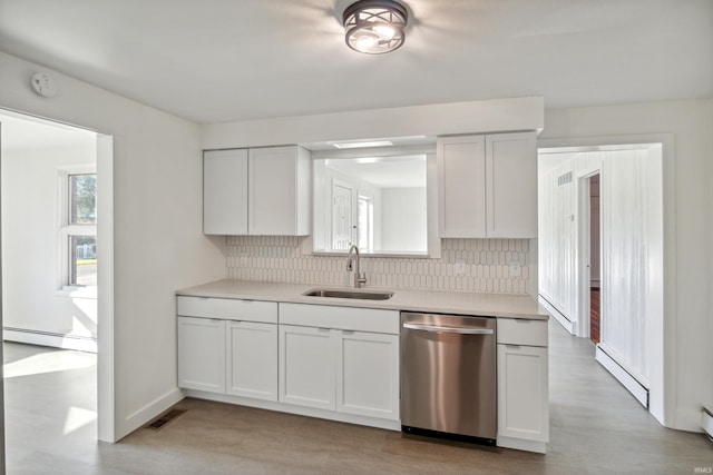 kitchen with decorative backsplash, visible vents, dishwasher, and a sink