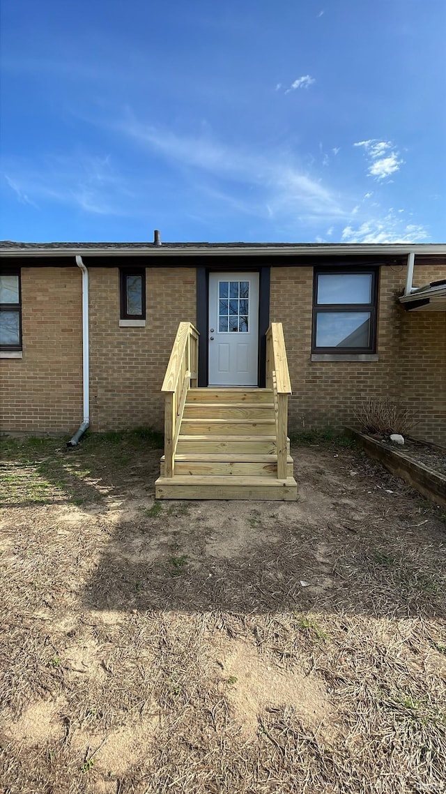 exterior space with brick siding