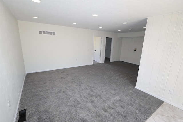 carpeted spare room with recessed lighting, visible vents, and baseboards