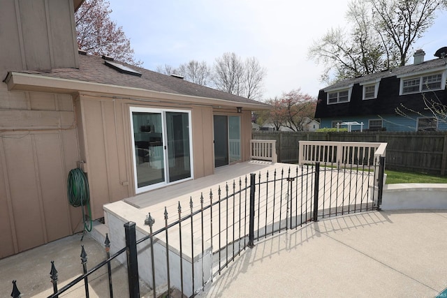 view of patio featuring fence