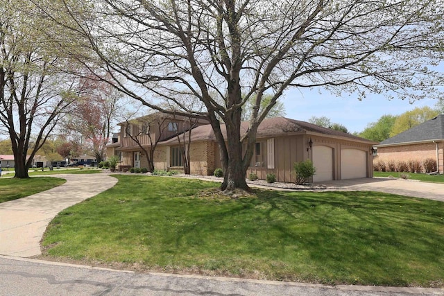view of front of property with board and batten siding, a front lawn, driveway, and an attached garage