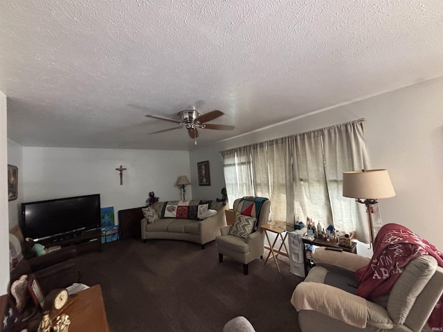 living area featuring ceiling fan, carpet flooring, and a textured ceiling