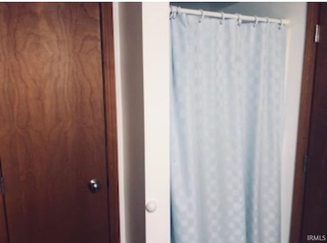 bathroom with a shower with shower curtain