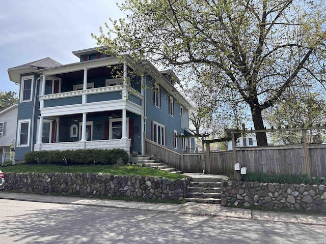 106 13th St, Winona Lake, IN 46590 - american foursquare style home with fence and a balcony