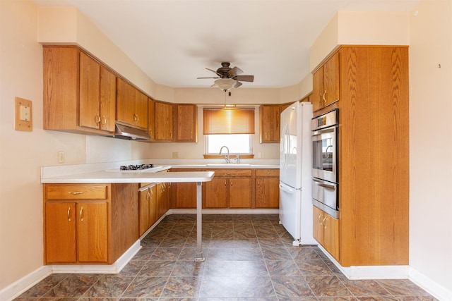 315 E Dean St, South Bend, IN 46614 - kitchen featuring oven, a warming drawer, ceiling fan, under cabinet range hood, and a sink