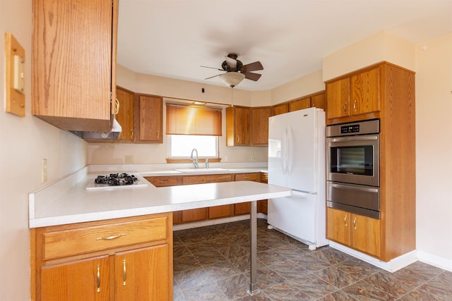315 E Dean St, South Bend, IN 46614 - kitchen featuring freestanding refrigerator, oven, a warming drawer, a sink, and gas cooktop