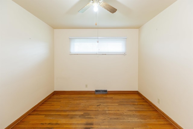 315 E Dean St, South Bend, IN 46614 - unfurnished room featuring wood finished floors, ceiling fan, and baseboards