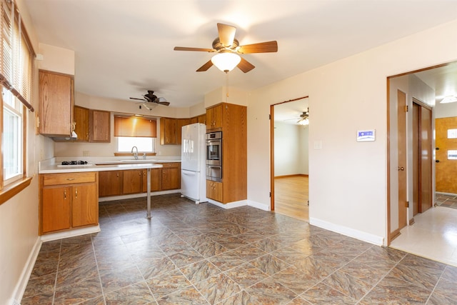 315 E Dean St, South Bend, IN 46614 - kitchen with stainless steel oven, a warming drawer, light countertops, and healthy amount of natural light