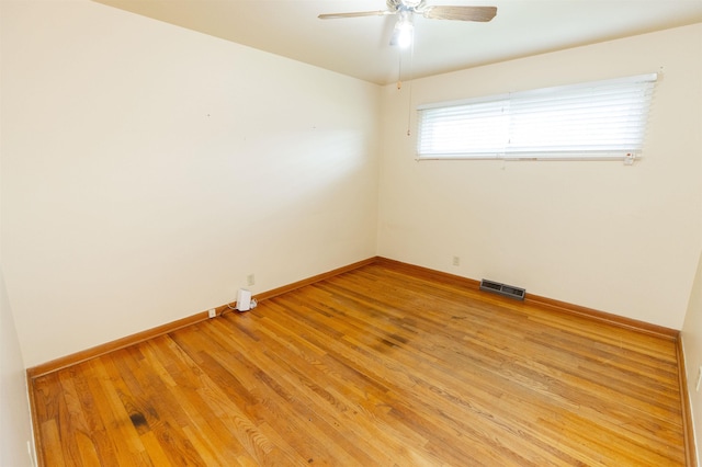 315 E Dean St, South Bend, IN 46614 - empty room featuring light wood-style flooring, ceiling fan, and baseboards
