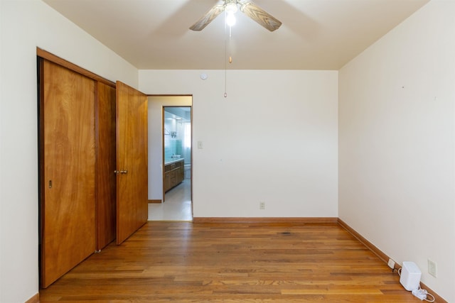 315 E Dean St, South Bend, IN 46614 - spare room featuring light wood-style flooring, ceiling fan, and baseboards