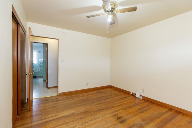 315 E Dean St, South Bend, IN 46614 - spare room with light wood-style floors, a ceiling fan, and baseboards