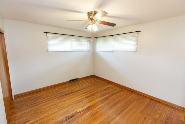 315 E Dean St, South Bend, IN 46614 - unfurnished room with light wood-style flooring, a ceiling fan, and baseboards