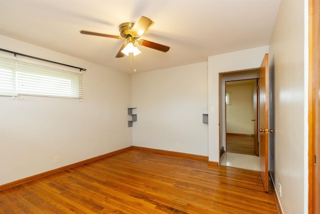 315 E Dean St, South Bend, IN 46614 - unfurnished room featuring wood finished floors, ceiling fan, and baseboards