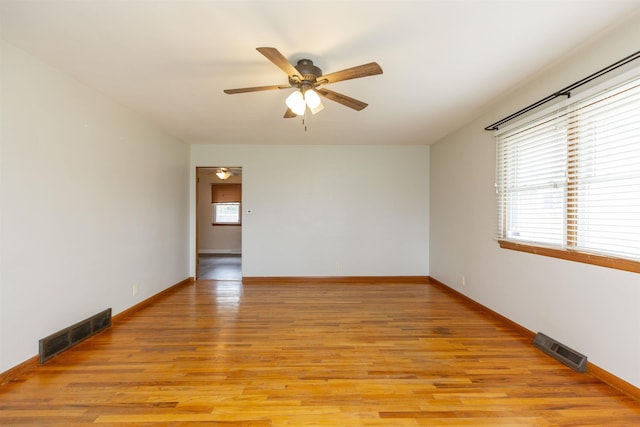 315 E Dean St, South Bend, IN 46614 - spare room featuring ceiling fan, light wood finished floors, and baseboards