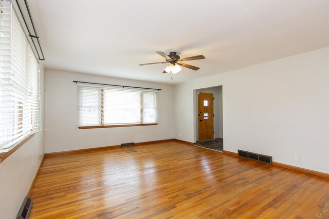 315 E Dean St, South Bend, IN 46614 - spare room featuring ceiling fan, light wood finished floors, and baseboards