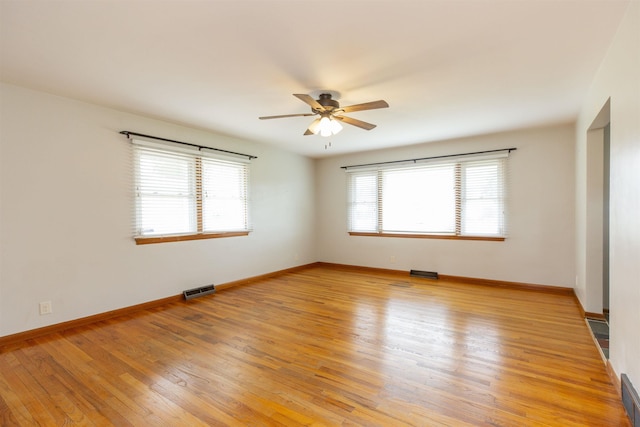 315 E Dean St, South Bend, IN 46614 - spare room featuring a ceiling fan, light wood-type flooring, and baseboards