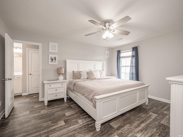 bedroom with a ceiling fan, visible vents, baseboards, and dark wood finished floors